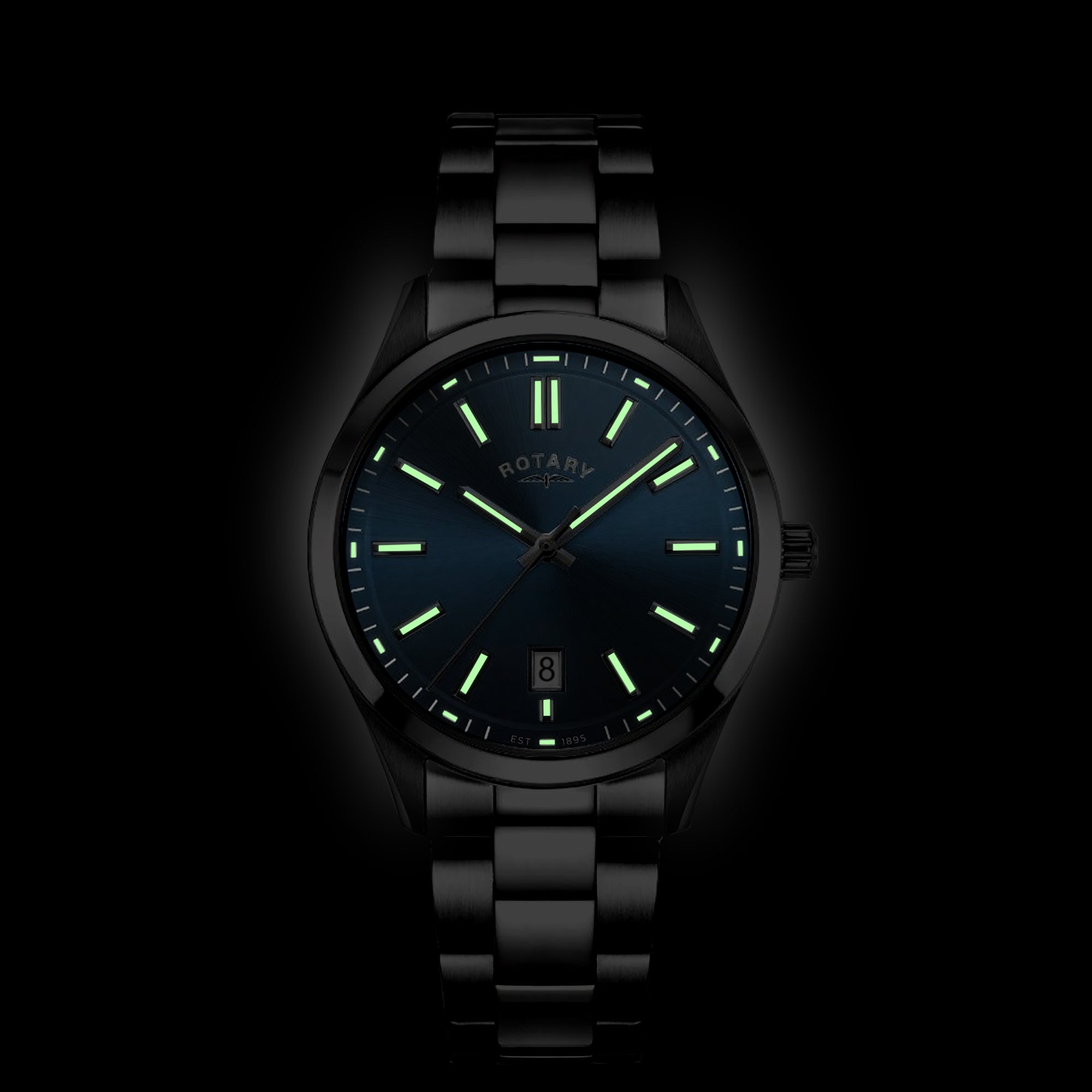 Rotary wristwatch with glowing green face on a black background