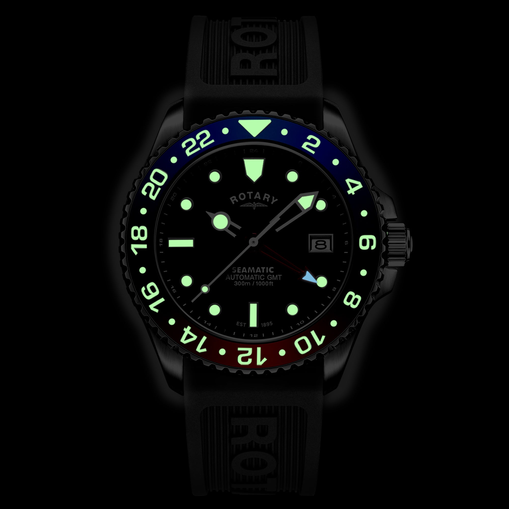 Rotary watch with glowing green face and numbers on a black background