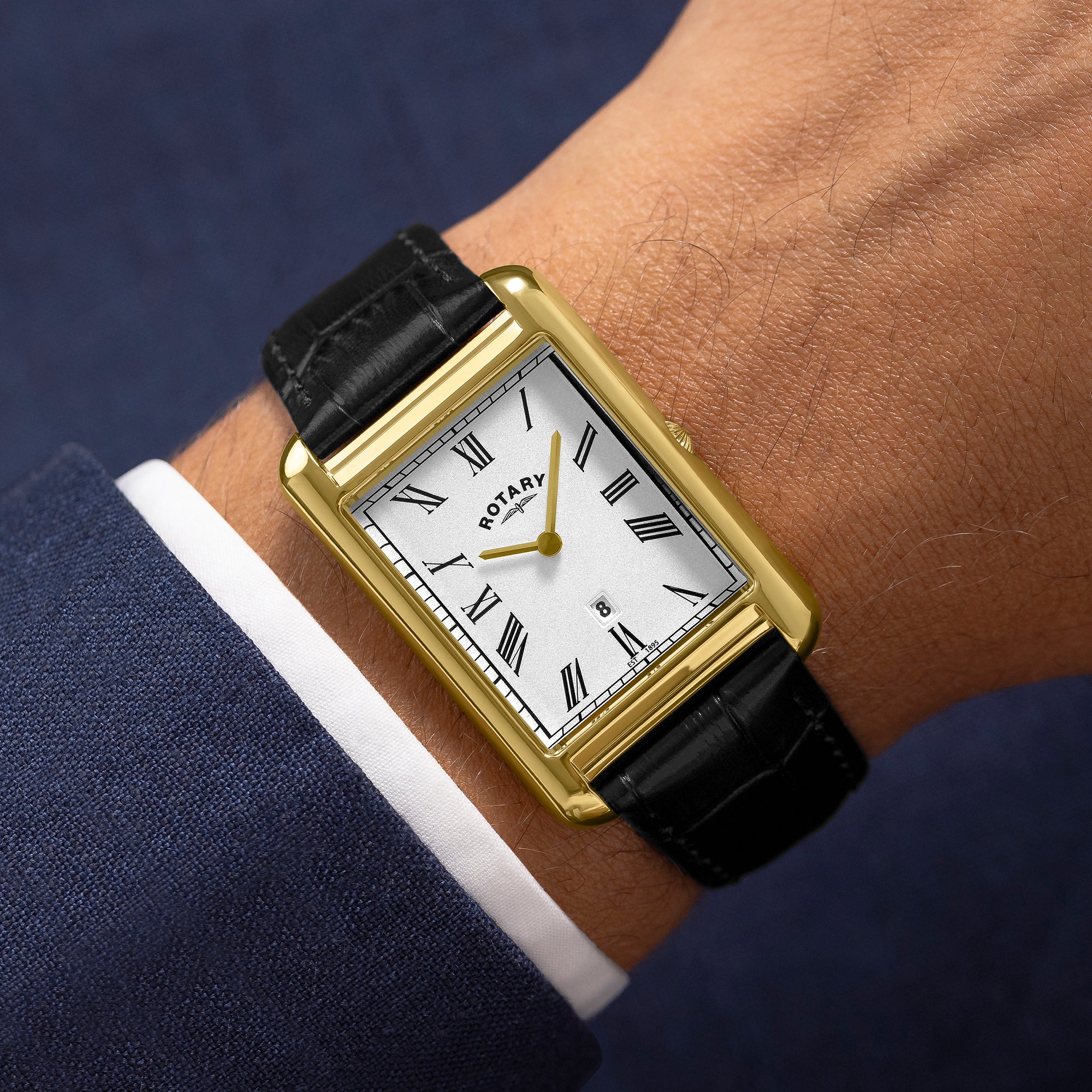 Gold Rotary wristwatch with black leather strap on a wrist