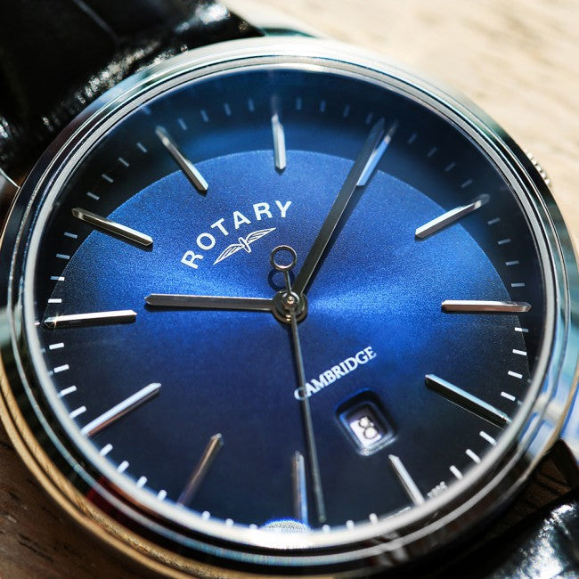 A rotary mans watch with a blue dial and stainless steel case