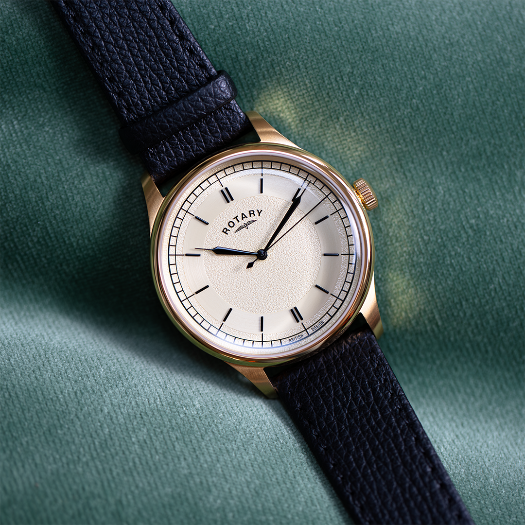 rotary traditional style dress watch in gold with a champagne dial and a black leather strap