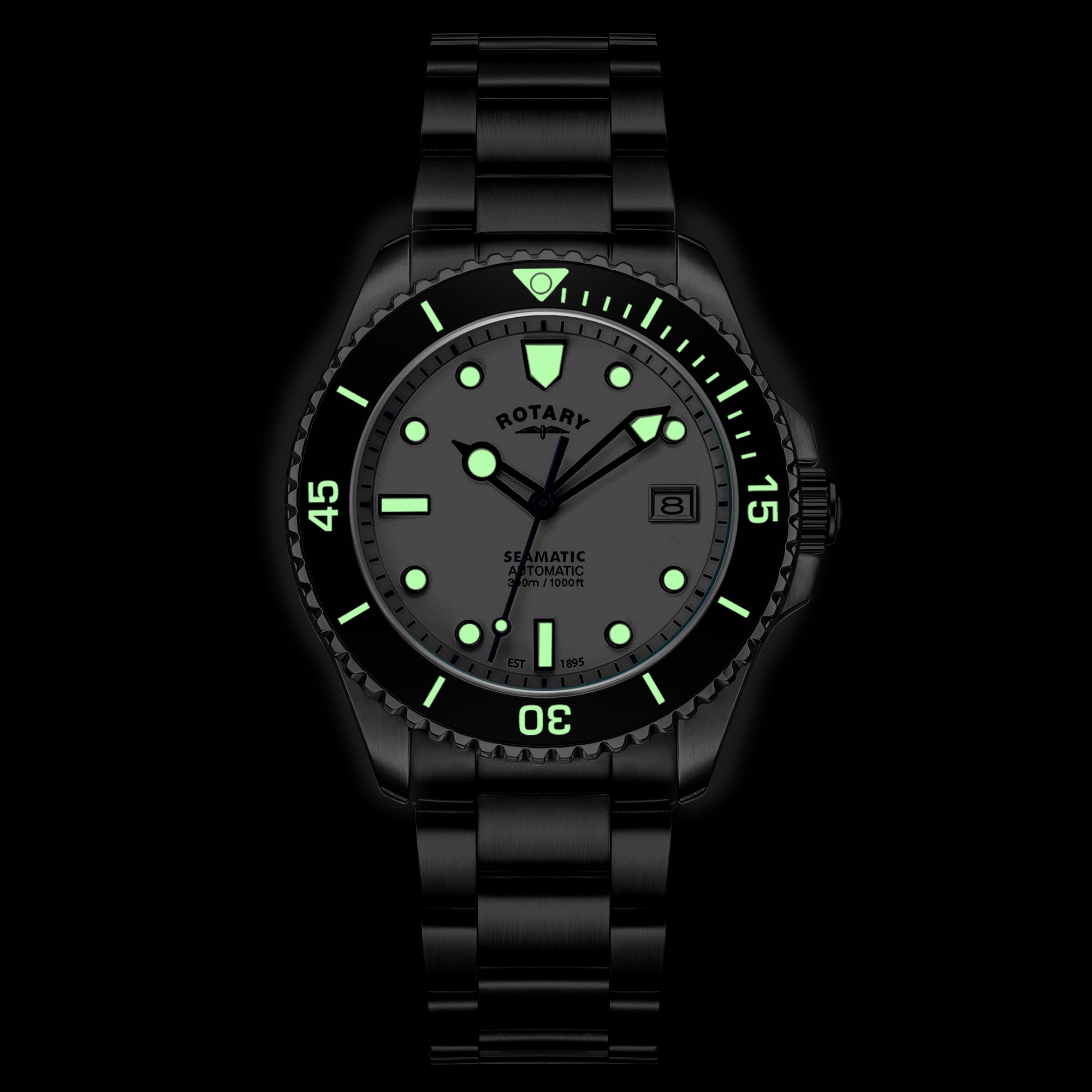Rotary Seamatic wristwatch with green glowing dial on a black background