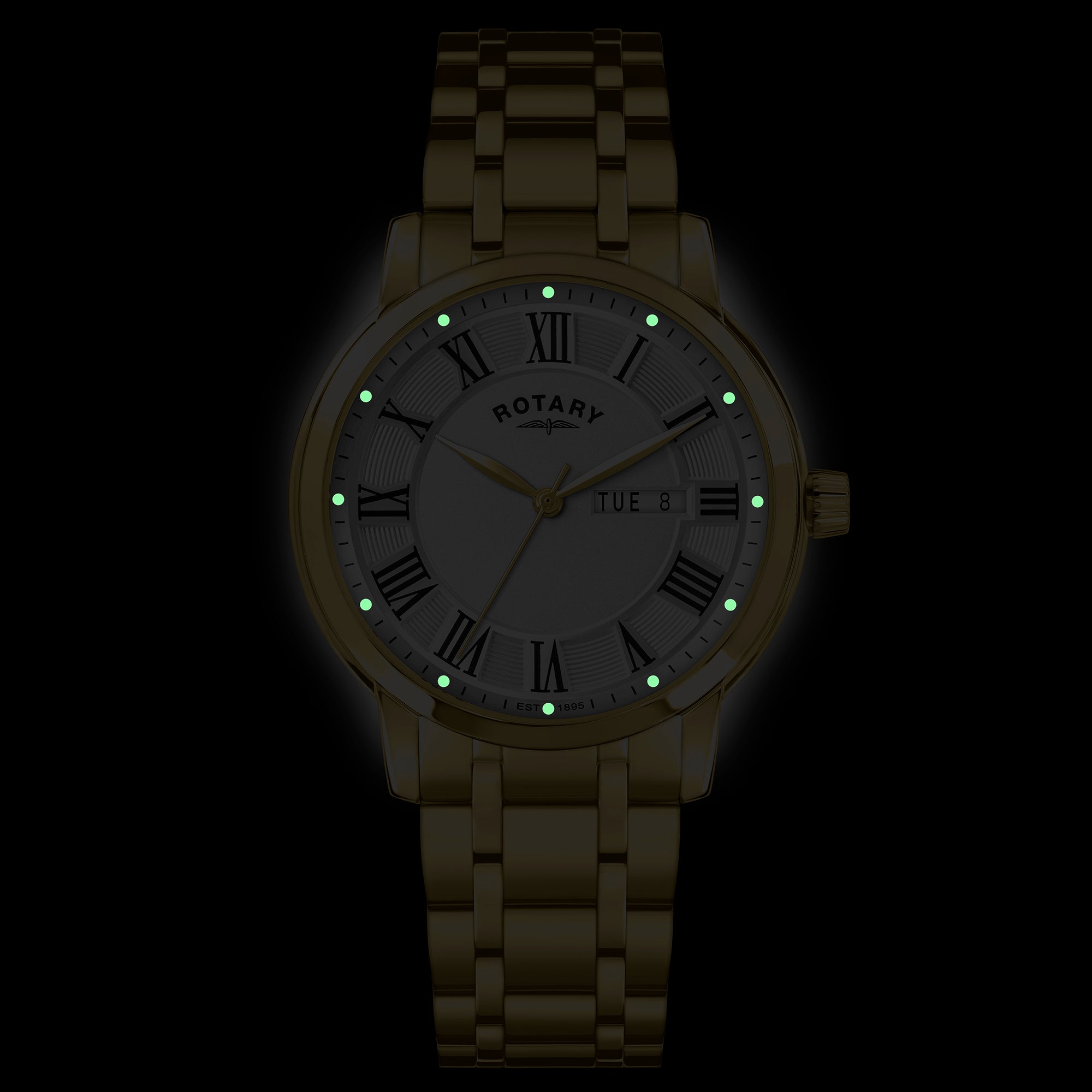 Rotary wristwatch with glowing lume indices on a black background