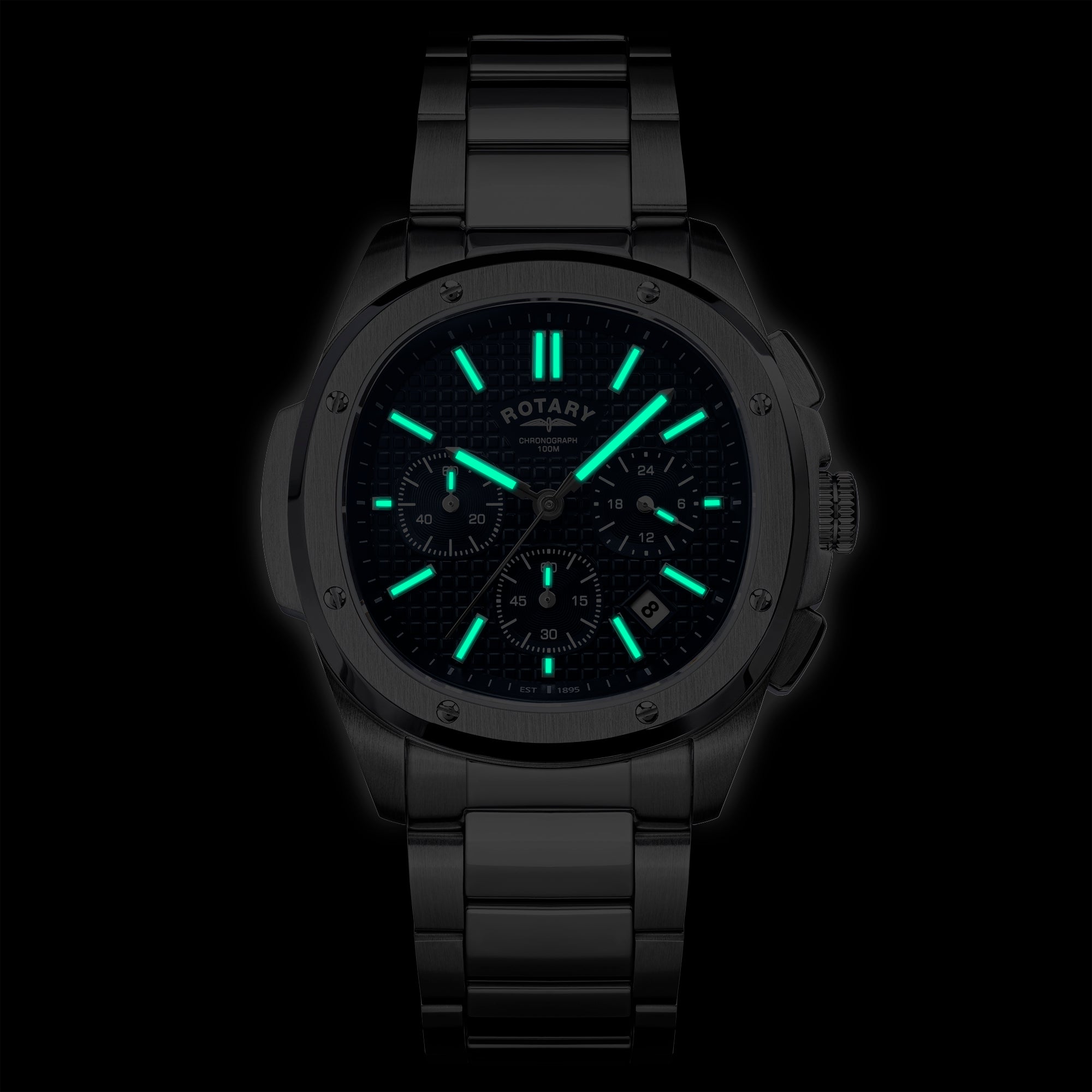 Rotary Apex100 Chronograph watch with glowing green face on a black background