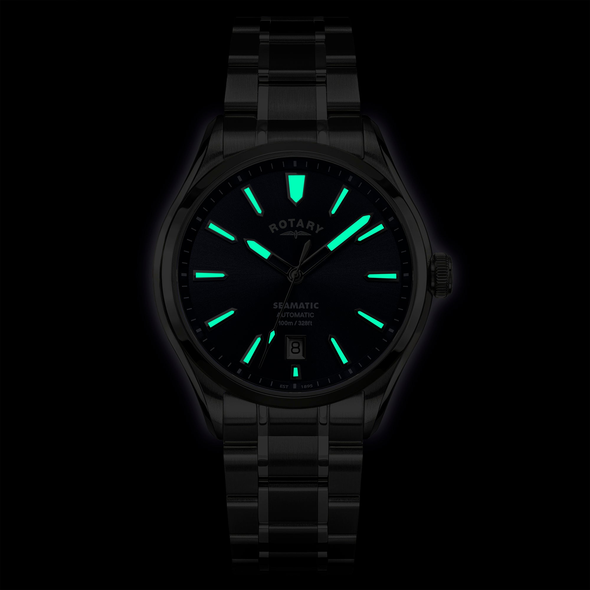 Rotary Seamatic 100 wristwatch with glowing green face on a black background