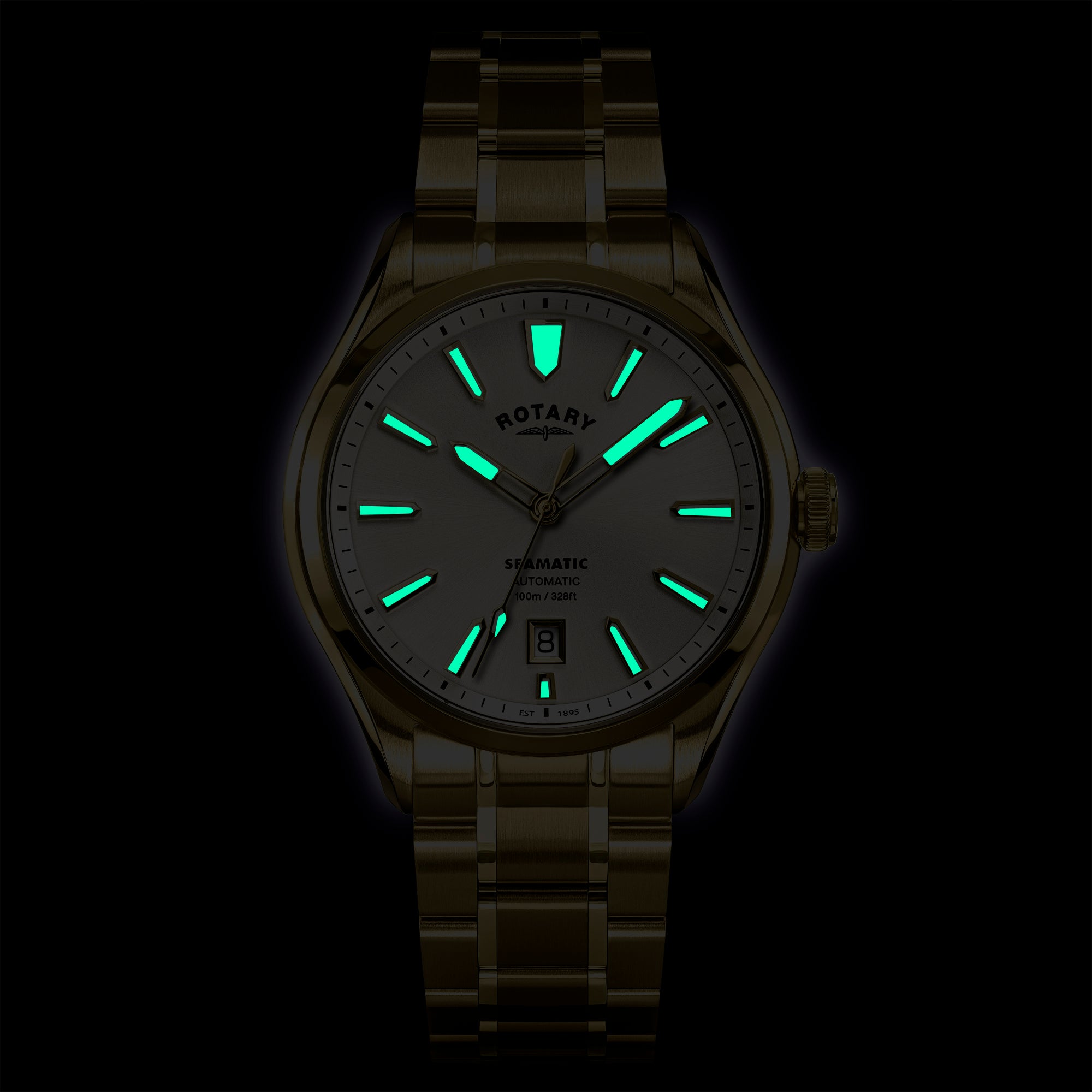 Glowing Rotary Seamatic 100 watch face with visible brand logo on a dark background