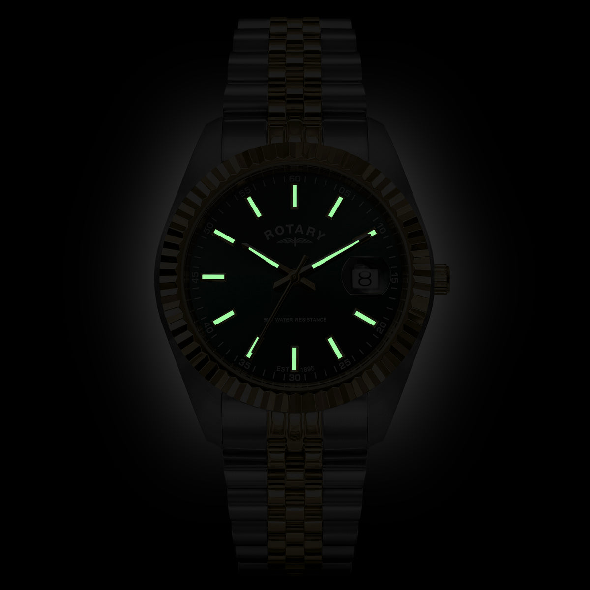 A two-tone Rotary wristwatch with a black dial, luminous green hour markers and hands, and a matching dark metal link bracelet, shown against a black background.