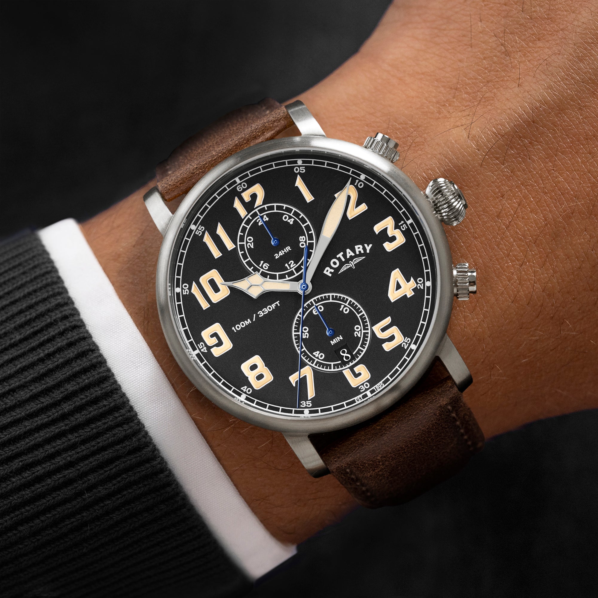 Rotary Apex100 Pilot watch with brown leather strap on wrist