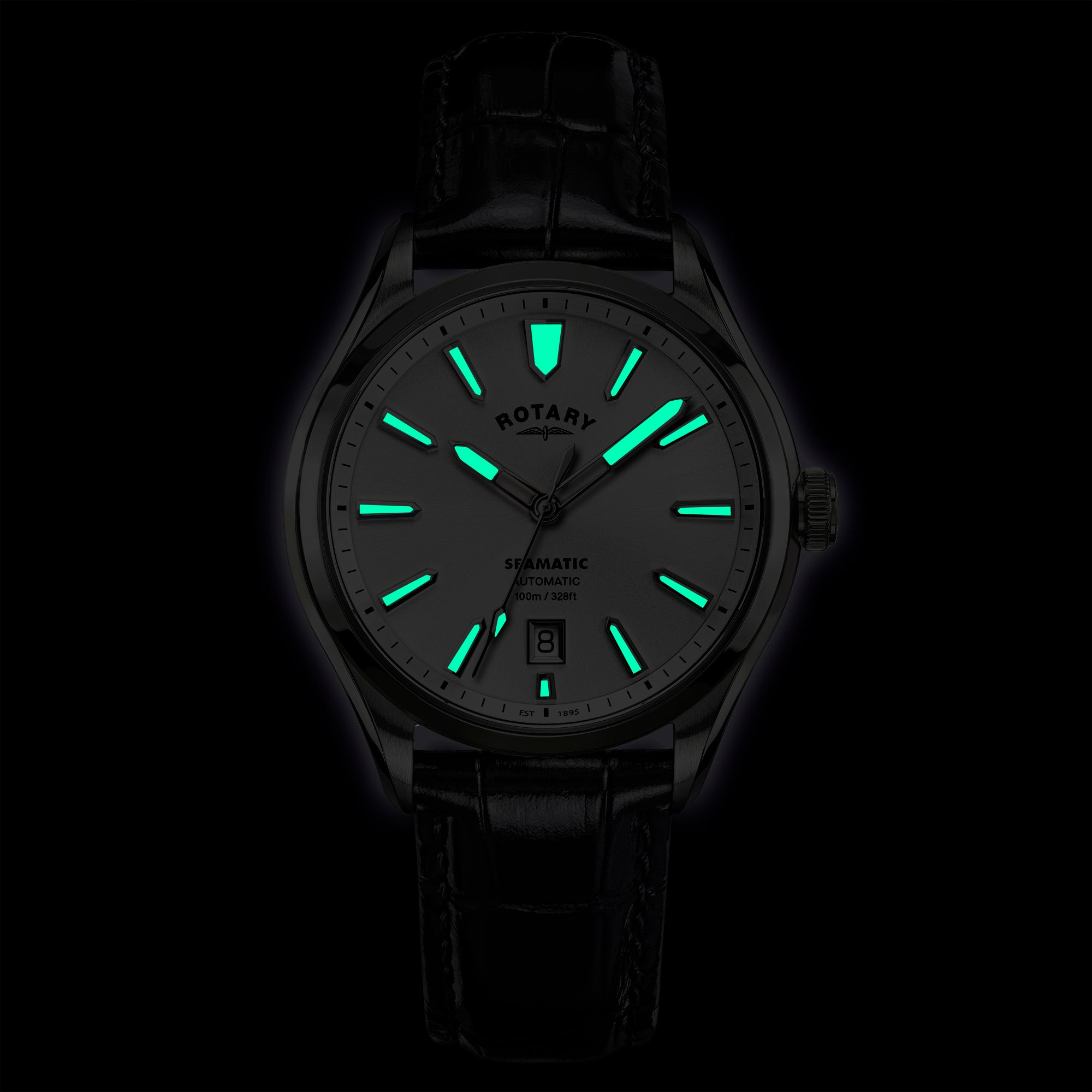 Rotary Seamatic 100 wristwatch with glowing green hands and markers on a black background.