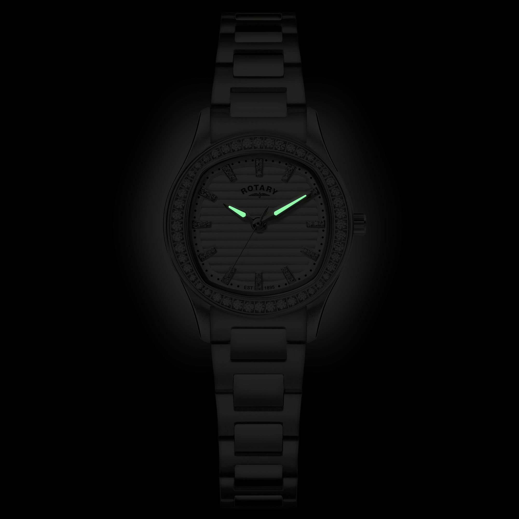 Rotary wristwatch with glowing green hands on a black background