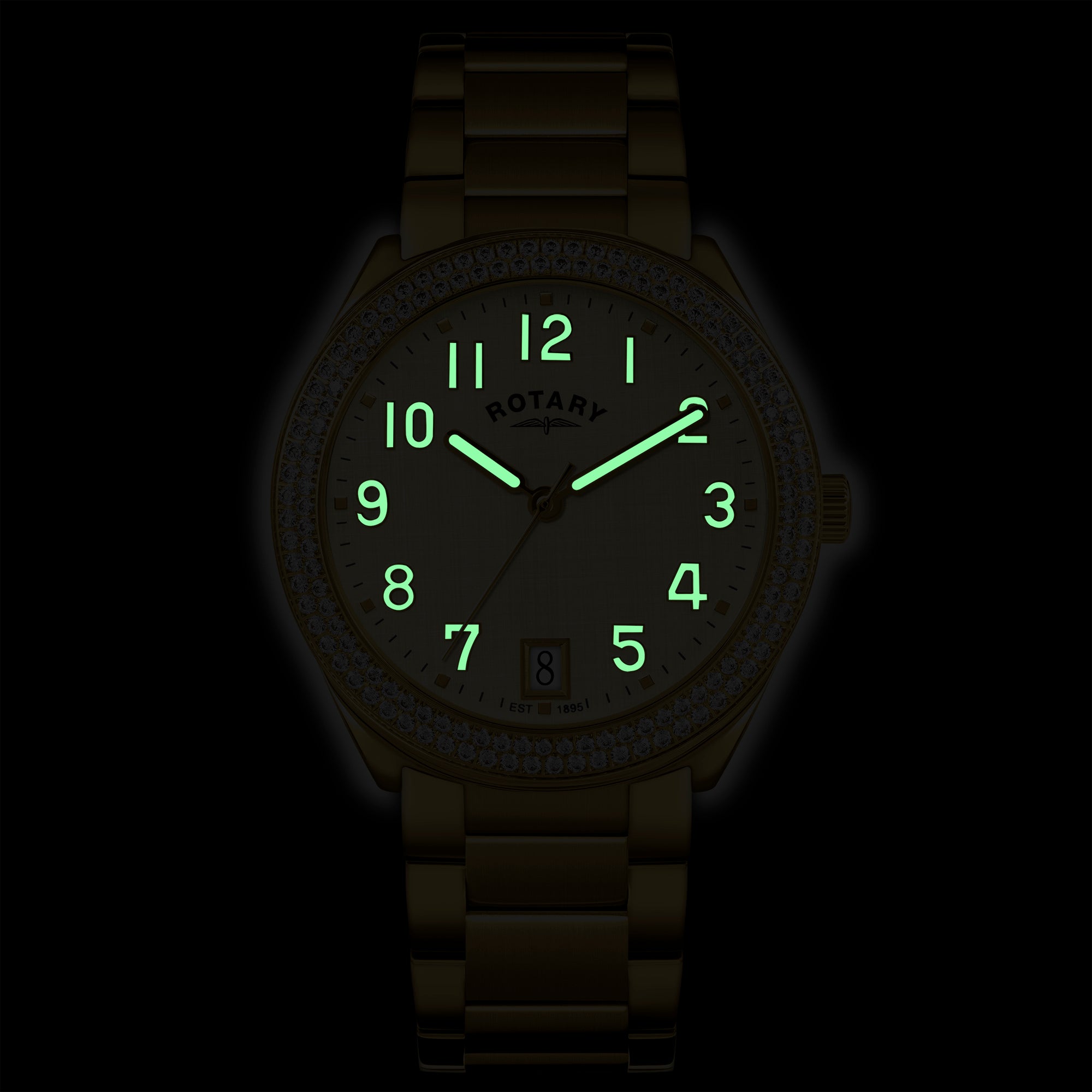 Gold Brilliance wristwatch with luminous indices on a black background