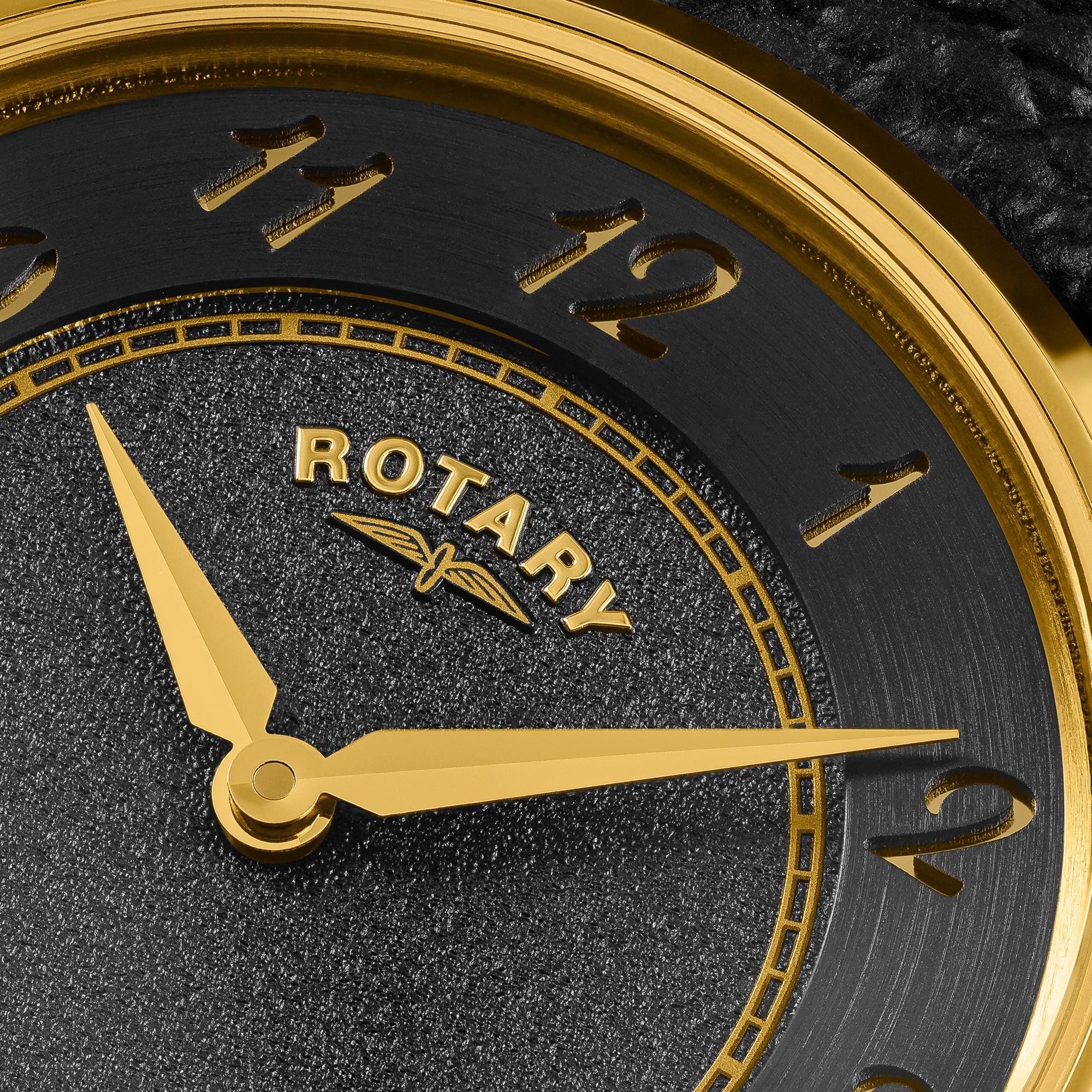 Close-up of a ladies Rotary Heritage watch face with gold hands and numbers on a dark background