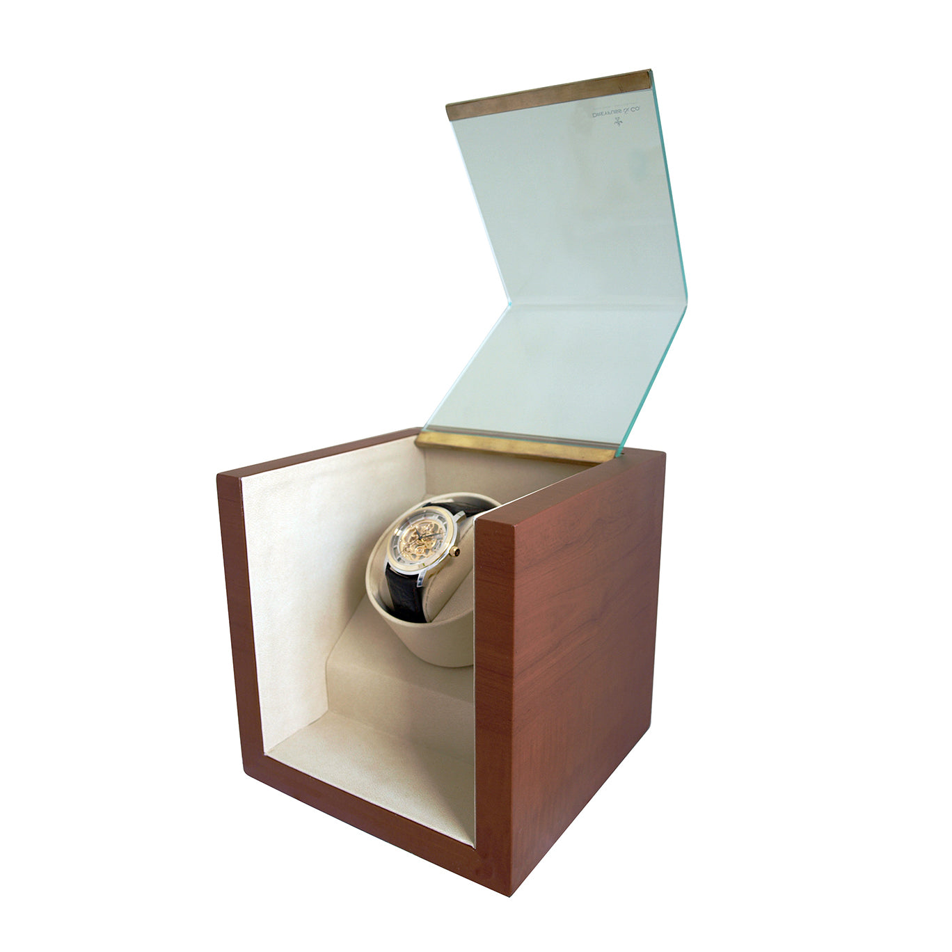 A dreyfuss & co watch winder box. The box is made of wood and features cream coloured leather inside