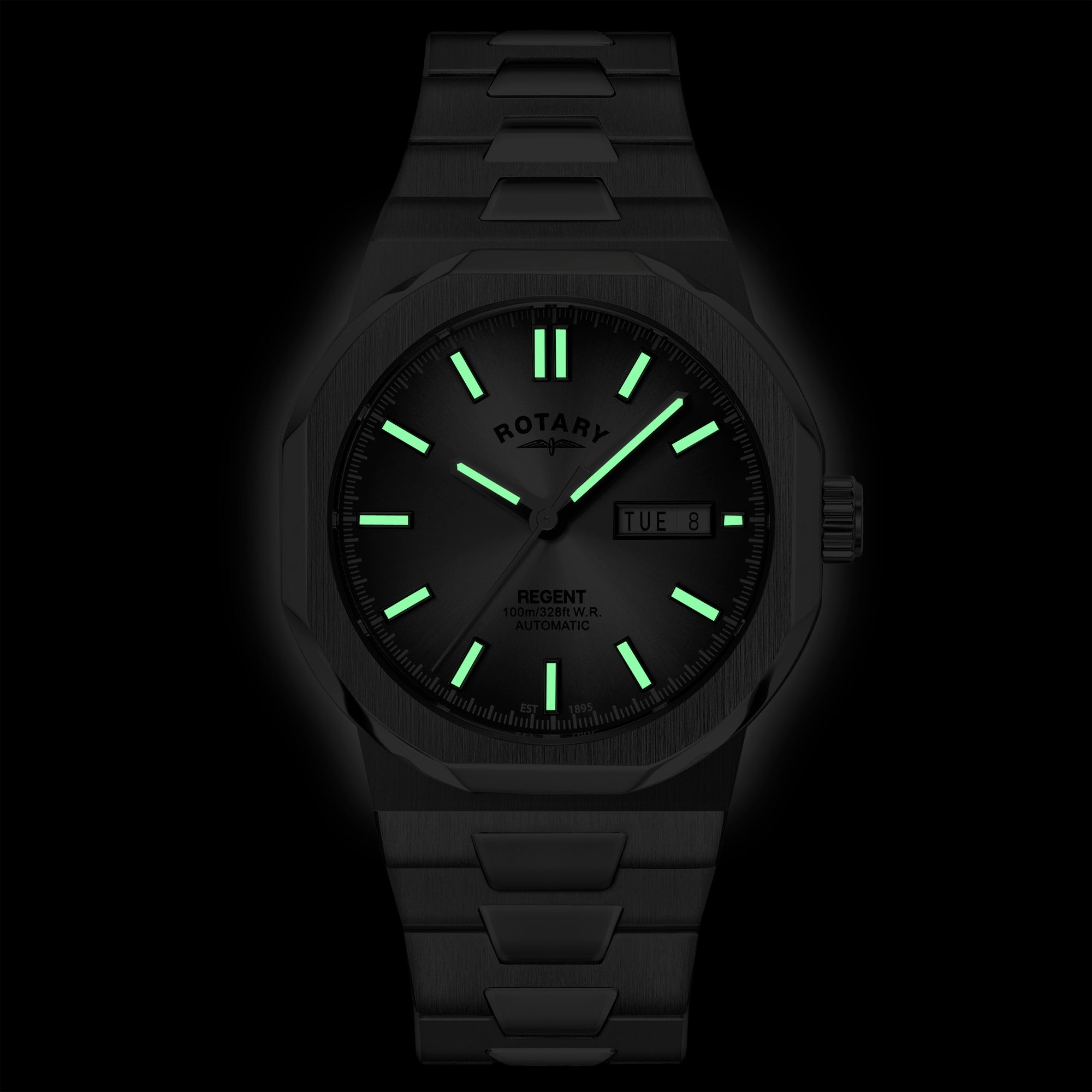 Rotary wristwatch with green glowing indices on a black background