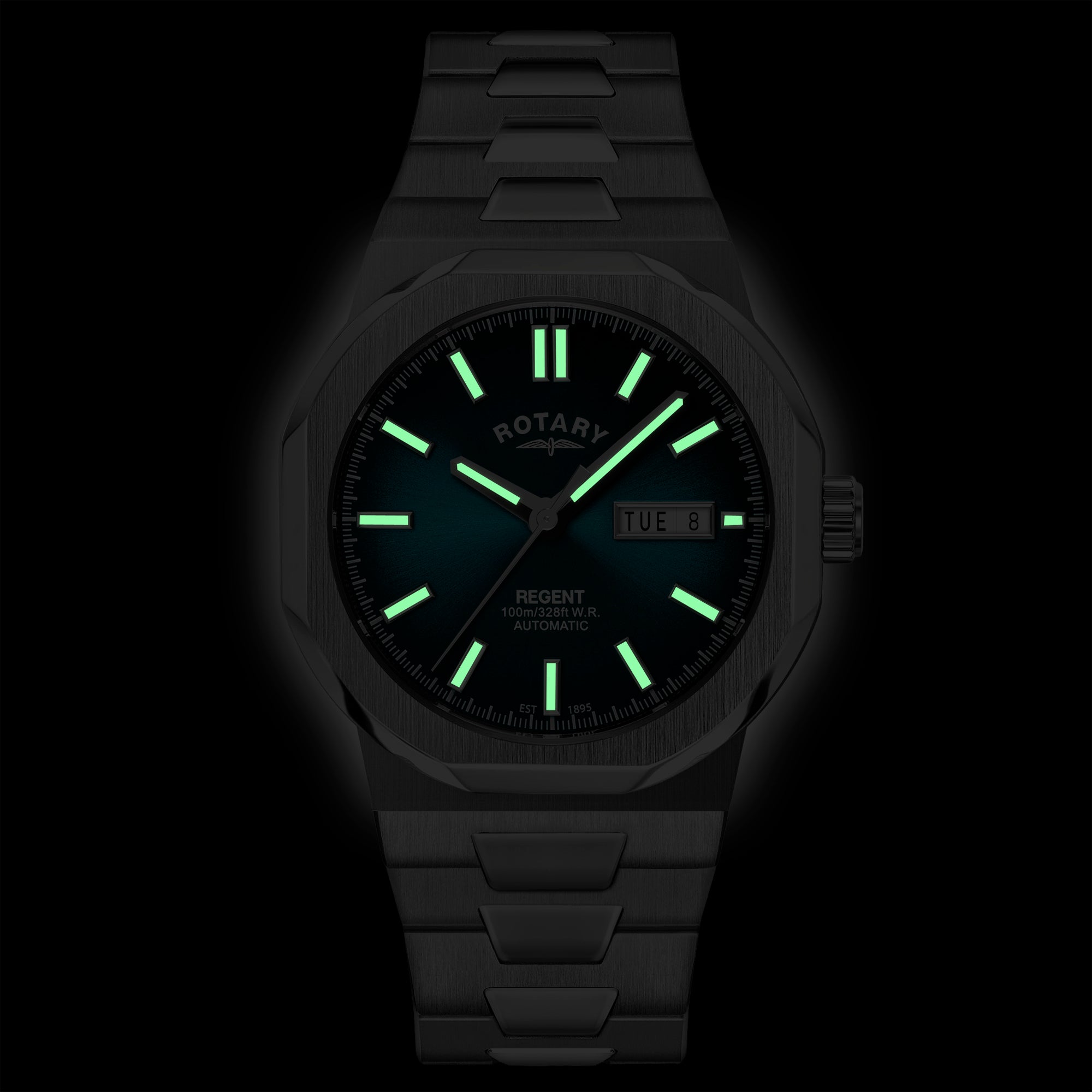 Rotary Regent wristwatch with glowing green indices and hands on a dark background