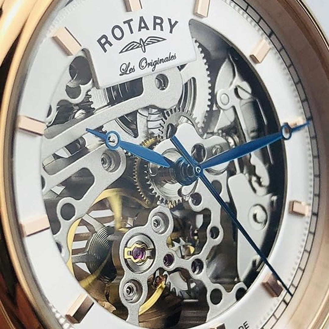 A close up of a rotary swiss made watch and its movement