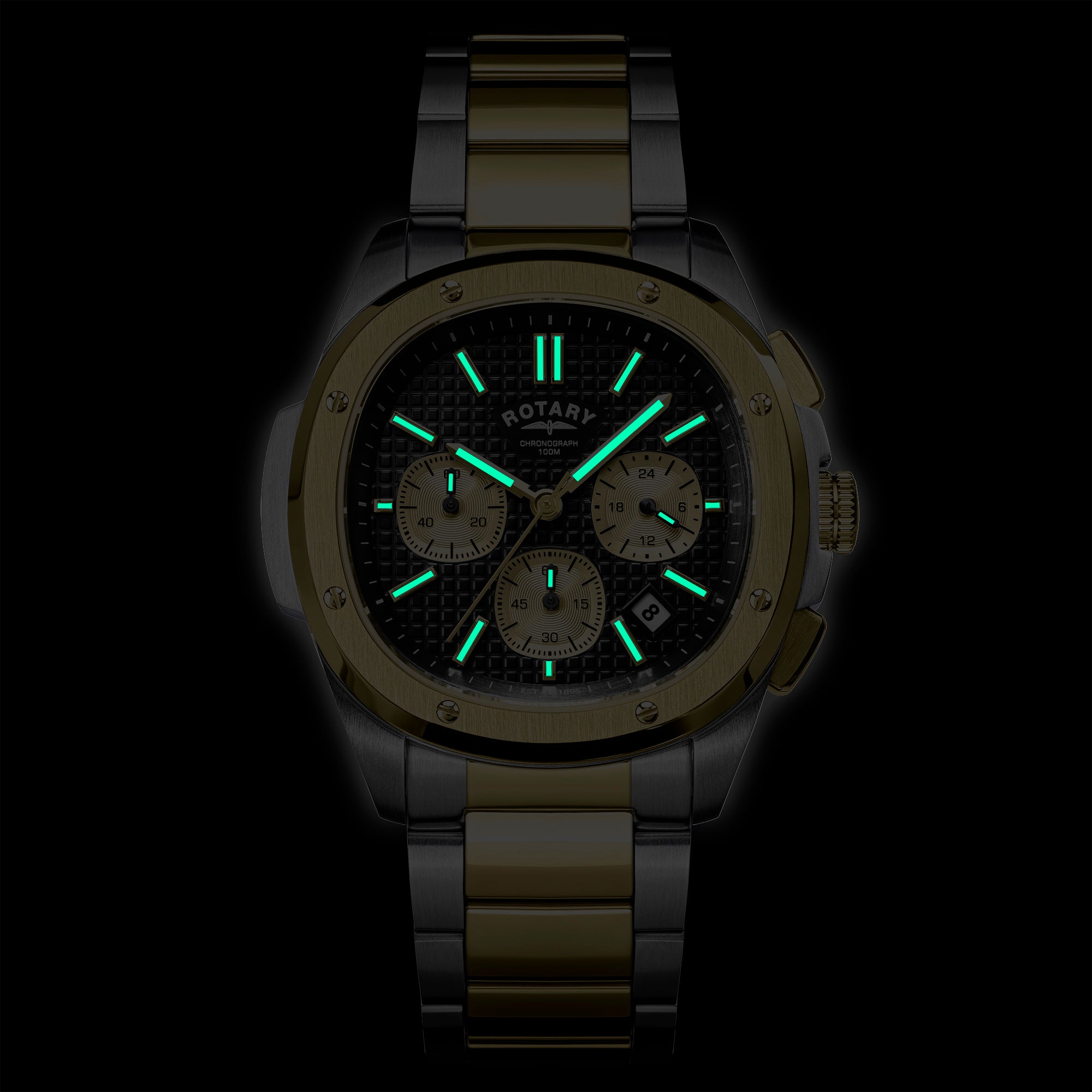 Rotary Apex100 Chronograph watch with green glowing face on a black background