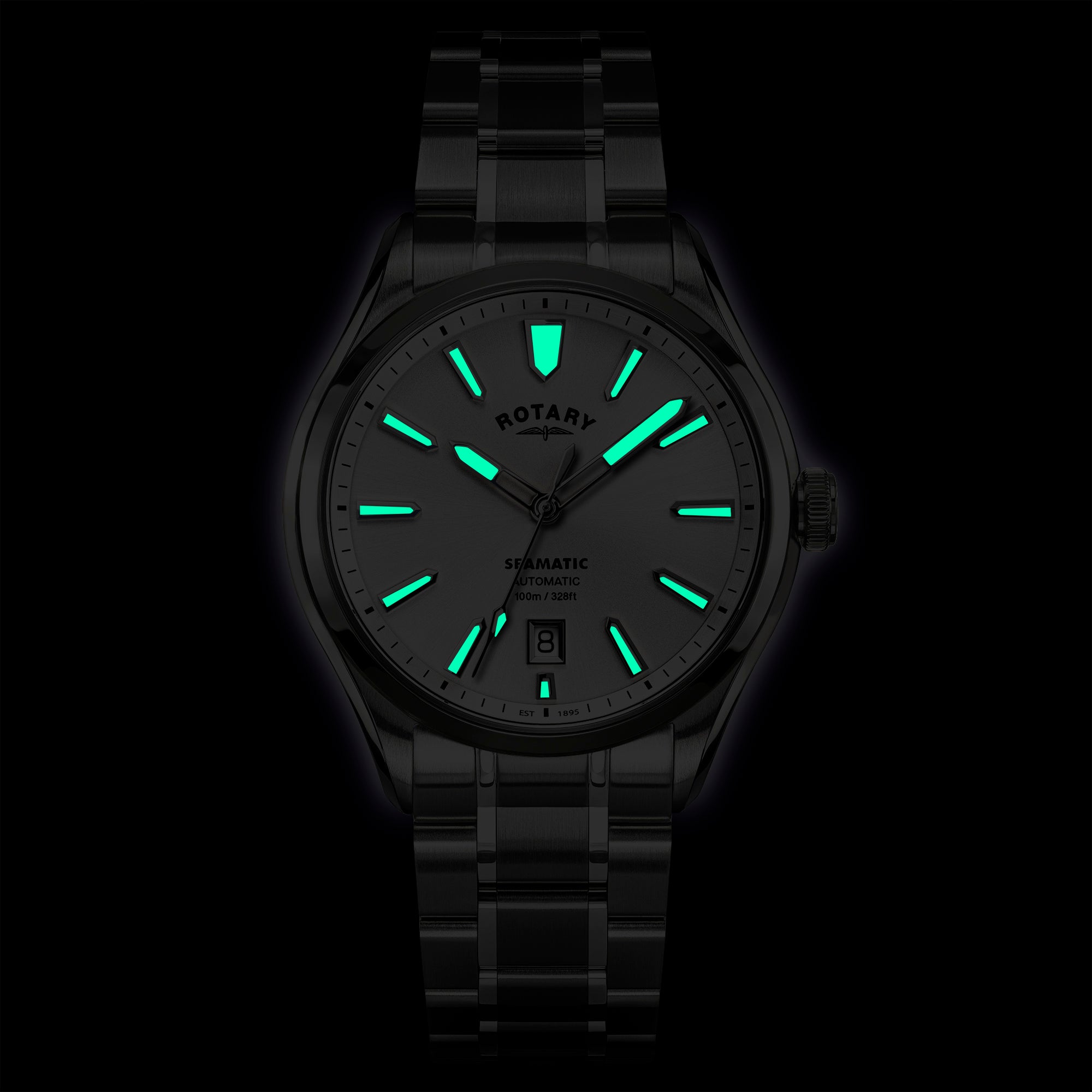 Rotary Seamatic 100 wristwatch with glowing green face on a black background