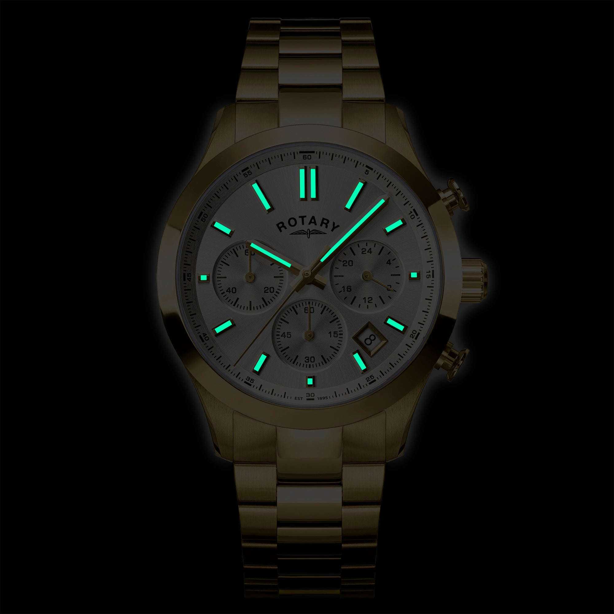 Gold Rotary Heritage Chronograph wristwatch with glowing green face on a black background