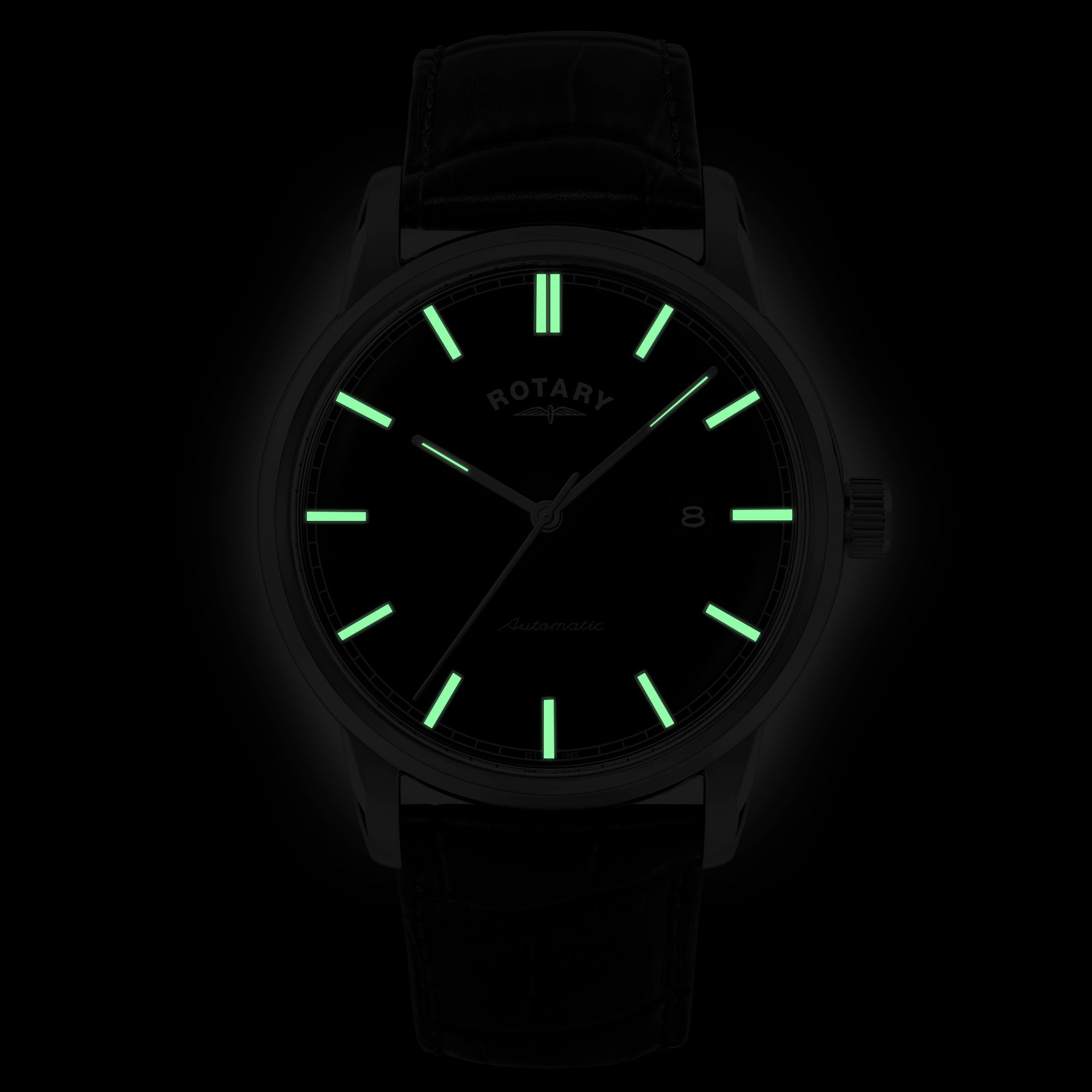 Rotary wristwatch with glowing green hands and indices on a black background