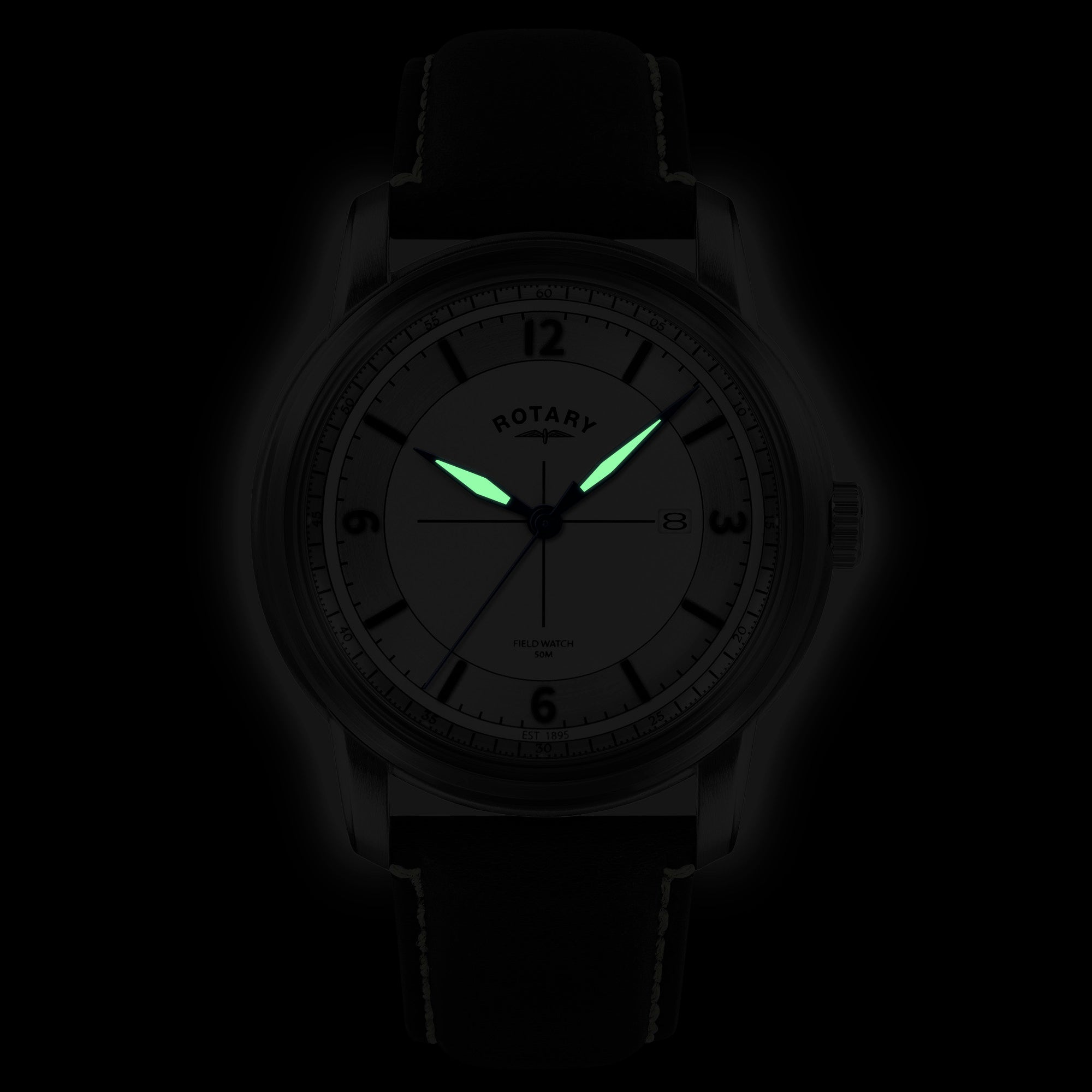 Rotary wristwatch with glowing hands on a dark background