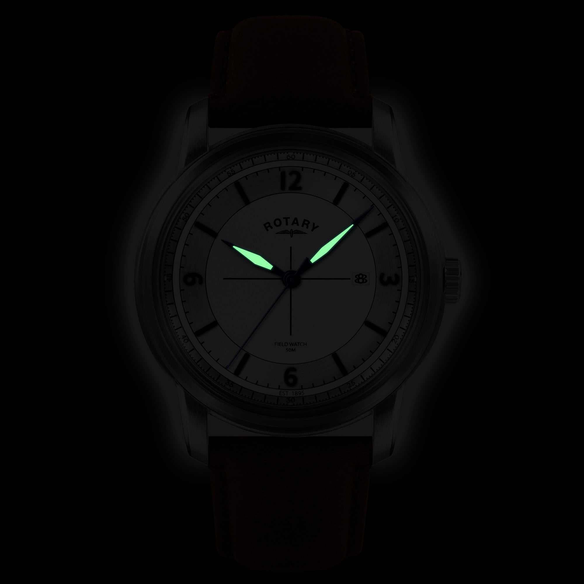 Rotary Watch with a silver dial and brown strap glowing in the dark