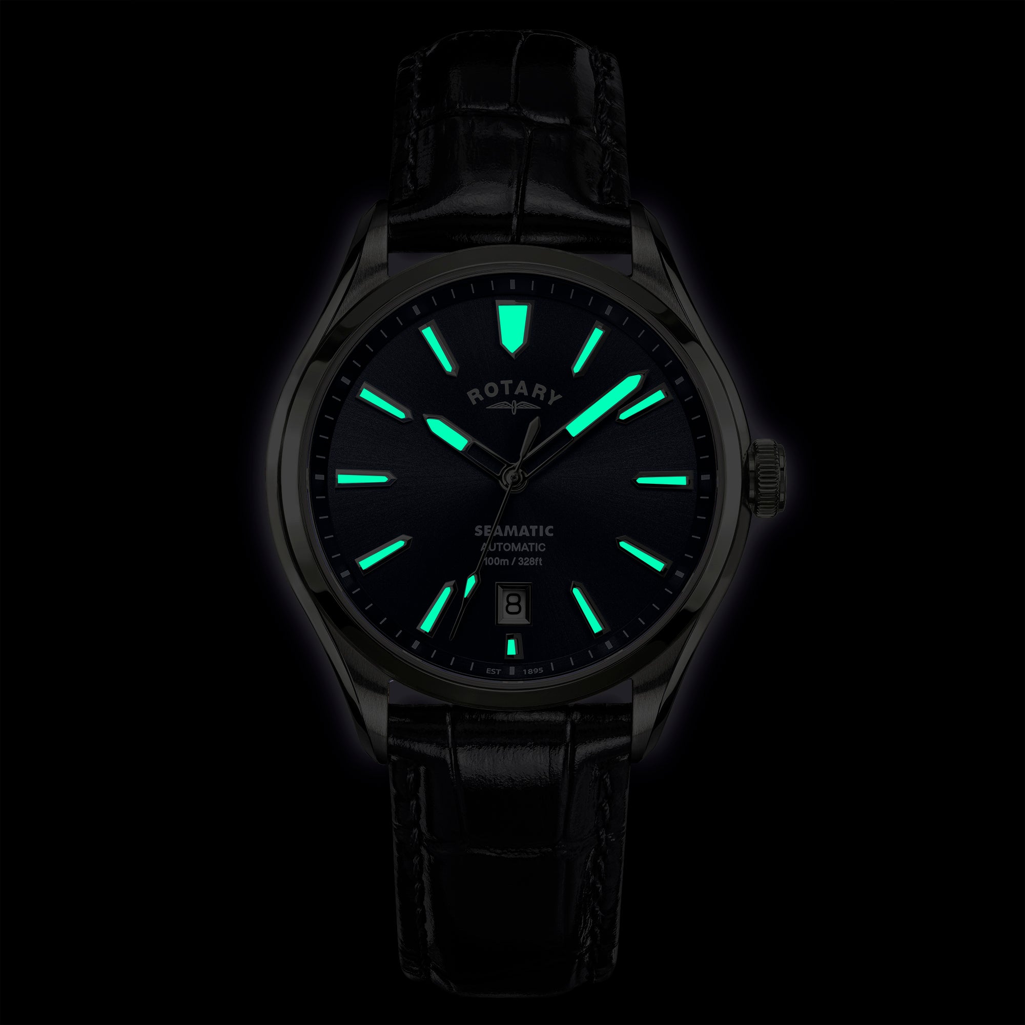 Rotary Seamatic 100 watch with glowing green hands and markers on a black background