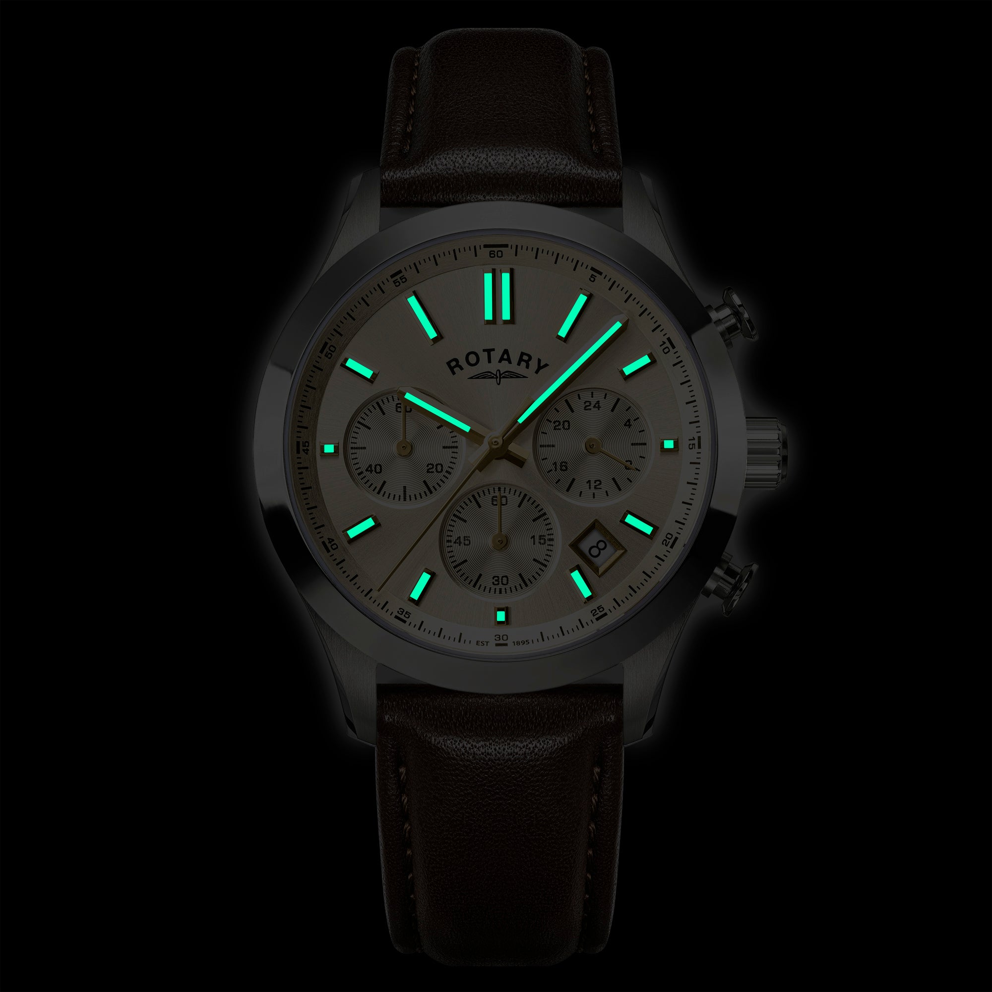 Glowing Rotary Heritage Chronograph watch face with green indicators on a black background.