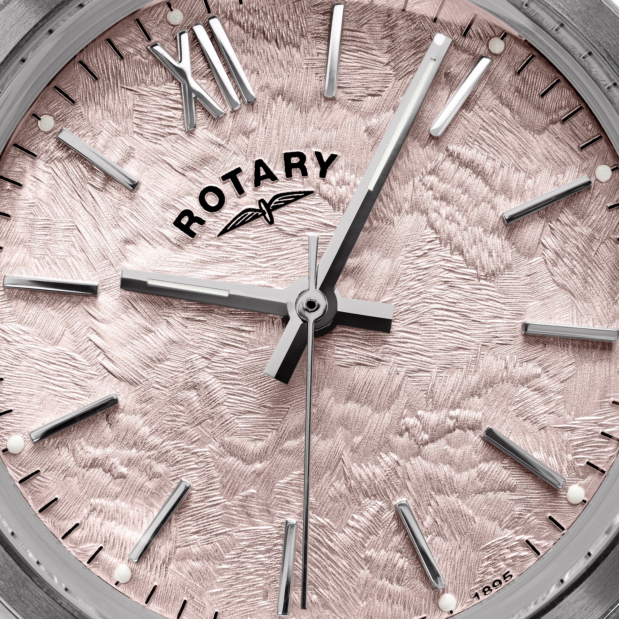 Close-up of a pink Rotary Heritage watch face with detailed design and logo.