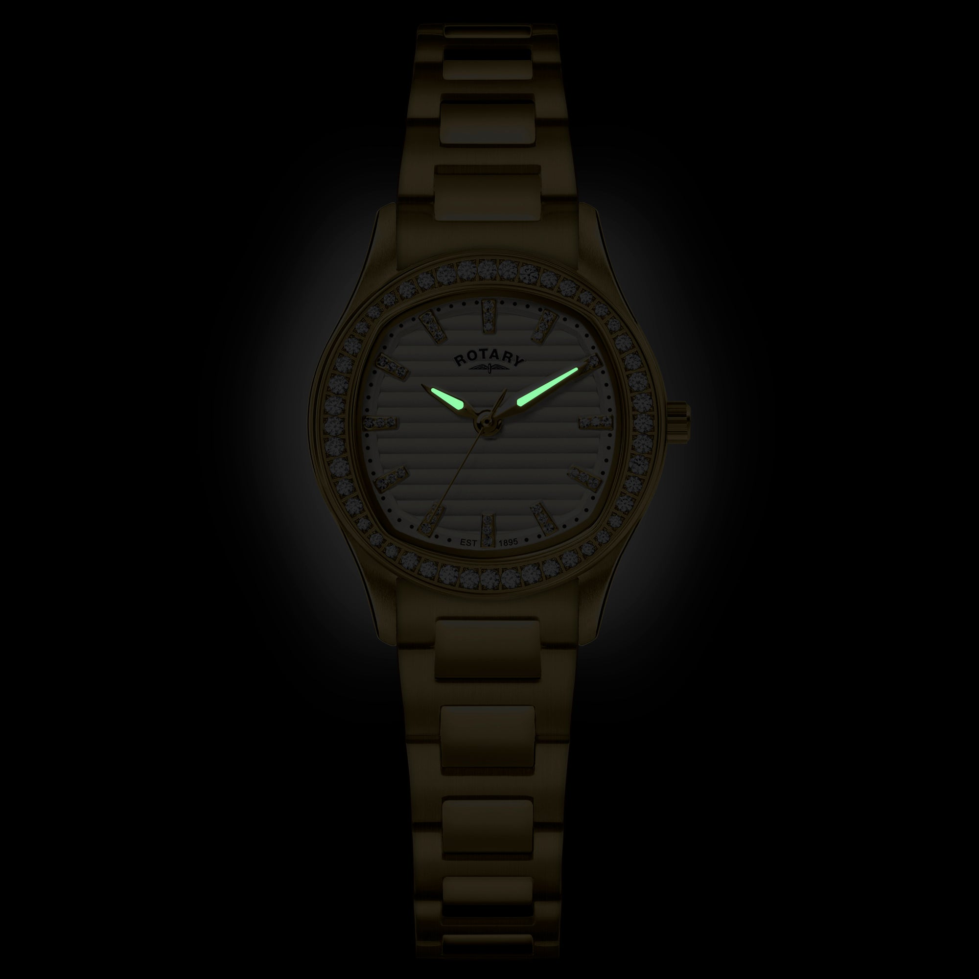 Gold rotary wristwatch with a dark background