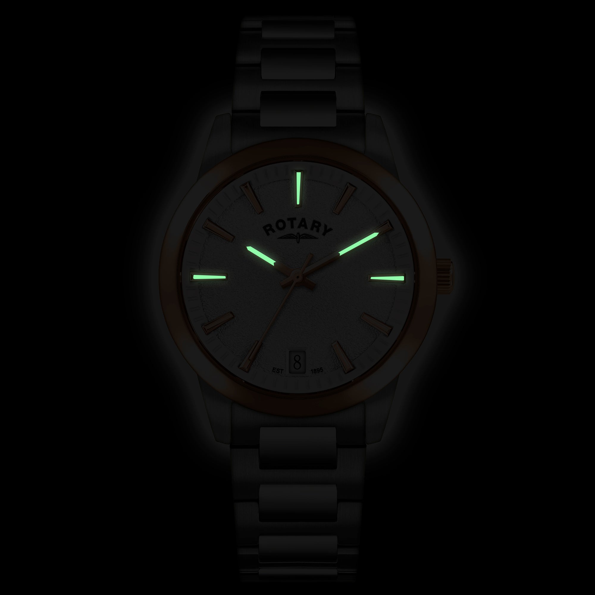 Rotary watch with glowing green hands and markers on a dark background