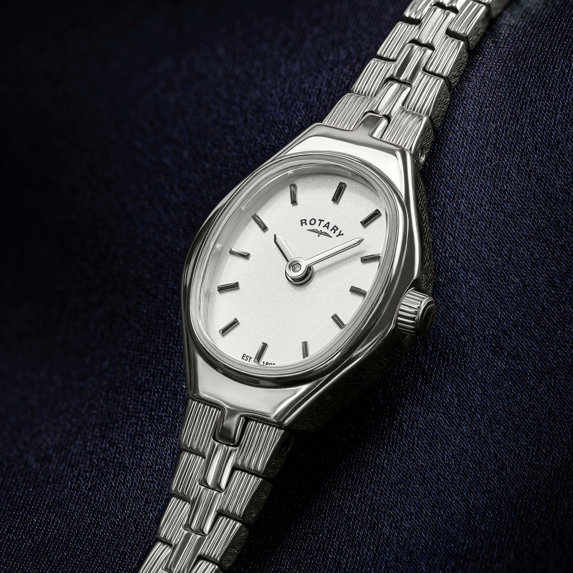 Silver ladies Rotary 1895 watch with a white face on a dark background