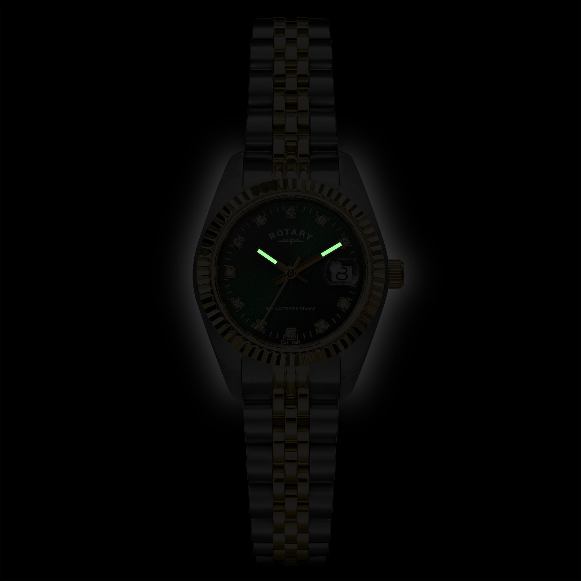 A dark Rotary wristwatch with a black dial, luminous green hands, and a matching black and gold-tone metal link bracelet, shown against a solid black background.