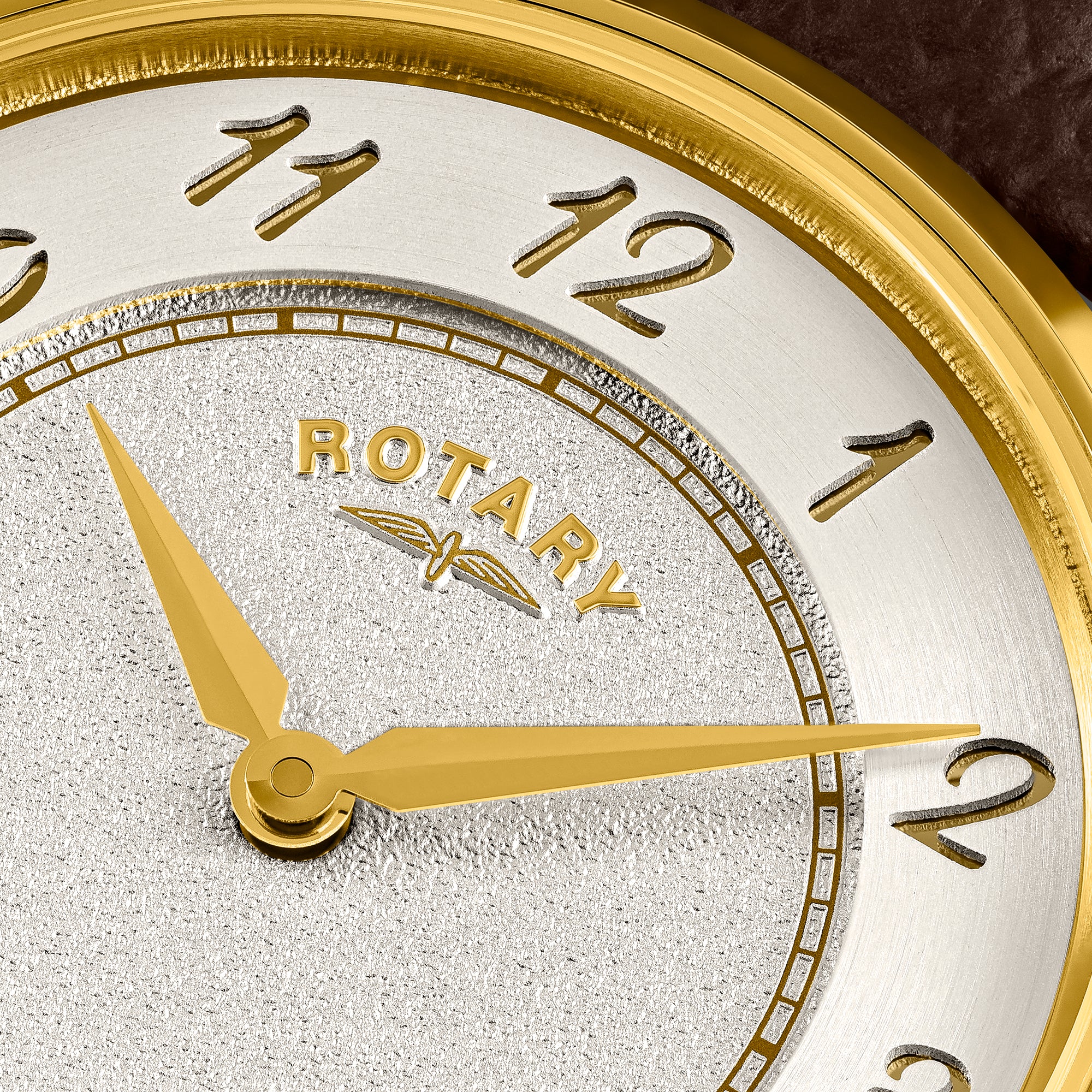 Close-up of a Rotary Heritage watch dial with gold hands and details.