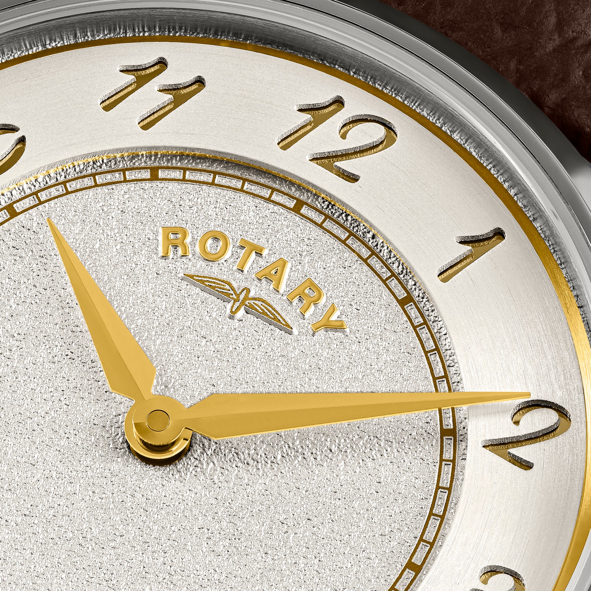 Rotary watch with brown leather strap and silver case on a white background