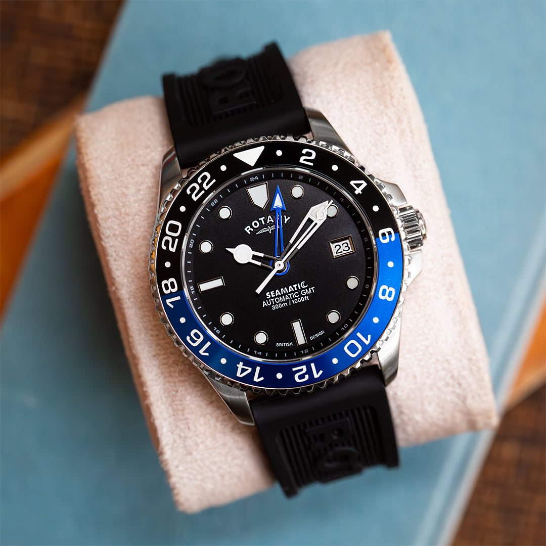 Seamatic GMT watch with a black and blue bezel, a blue GMT hand and a stainless steel case